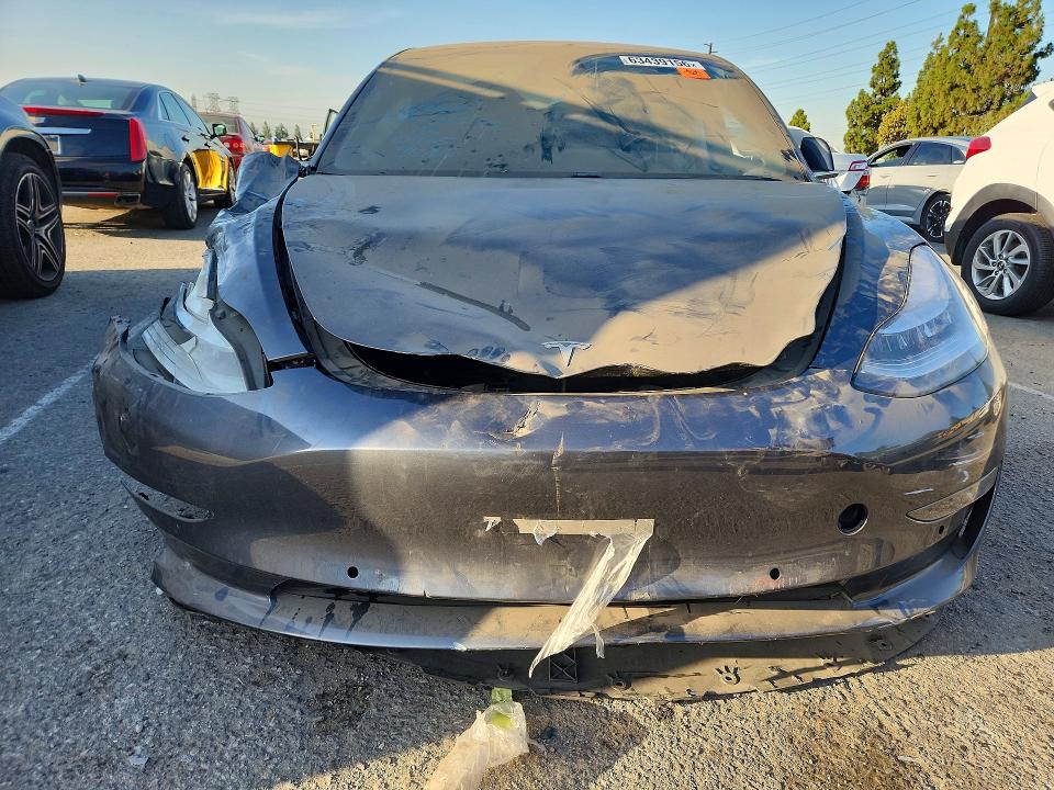 2018 Tesla Model 3 VIN 5YJ3E1EA3JF157661 COPART salvage auction — ALL OVER, CA - DIS/DLR/EXP ONLY CLEAN TITLE (P), sold $1,550 on 2026-10-08 (photo 5)
