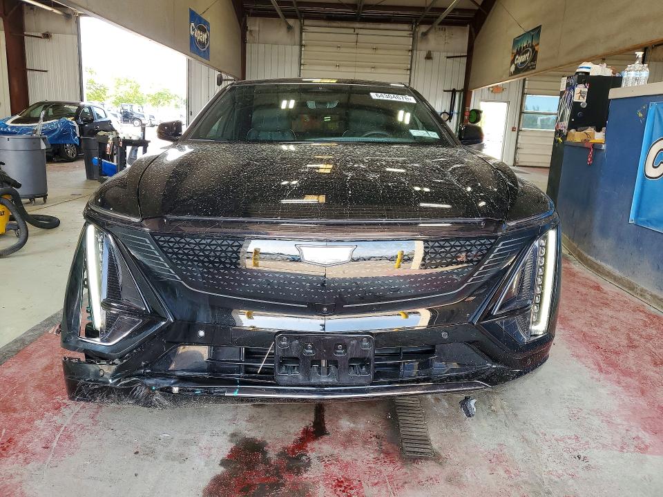 2025 Cadillac Lyriq VIN 1GYKPYRL8SZ314648 COPART salvage auction — FRONT END, Ny - Mv-907A Salvage Certificate, sold $22,200 on 2026-08-17 (photo 5)