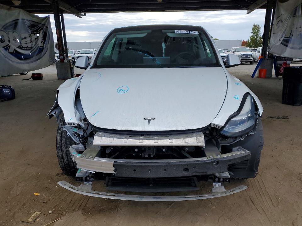 2021 Tesla Model y VIN 5YJYGAEE4MF242919 COPART salvage auction — FRONT END, Salvage Title, sold $11,400 on 2026-10-15 (photo 5)