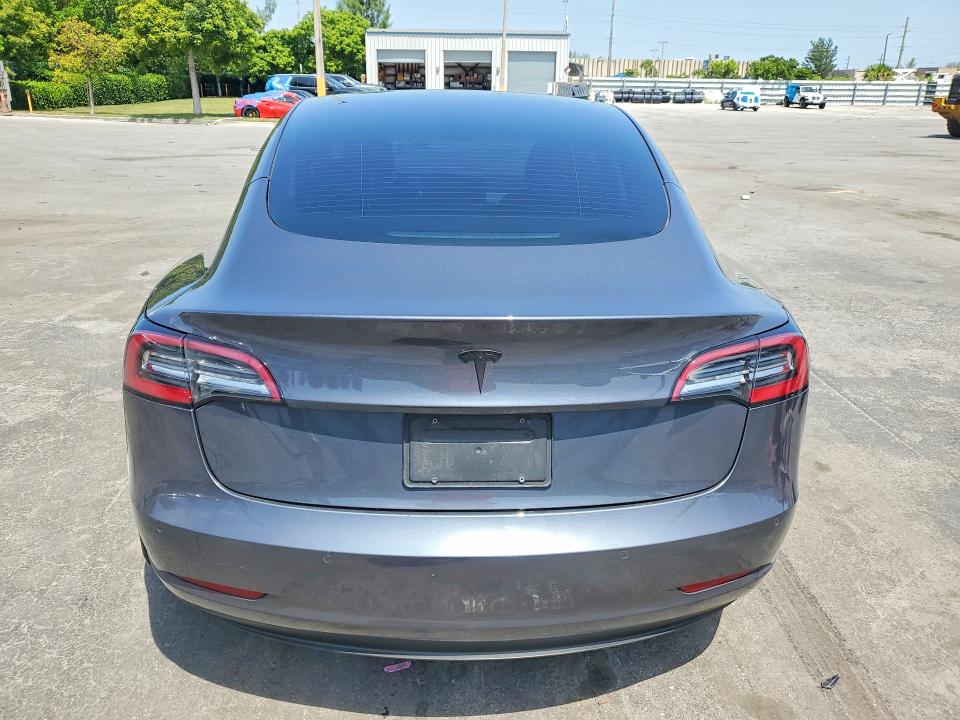 2021 Tesla Model 3 VIN 5YJ3E1EA8MF854022 COPART salvage auction — MINOR DENT/SCRATCHES, Fl - Cert Of Title-Rebuilt, sold $8,600 on 2026-09-09 (photo 6)
