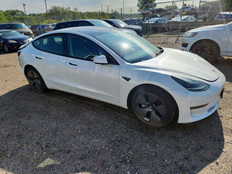 2023 Tesla Model 3 VIN 5YJ3E1EA7PF437687 COPART salvage auction — REAR END, Fl - Certificate Of Destruction, sold $11,600 on 2026-09-22 (photo 4)