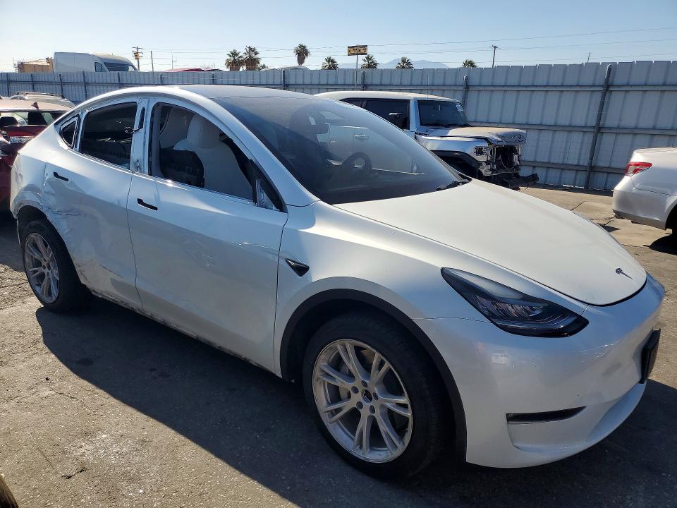 2023 Tesla Model y VIN 7SAYGDEEXPA153779 COPART salvage auction — SIDE, Ca - Salvage Certificate, sold $10,300 on 2026-08-31 (photo 4)