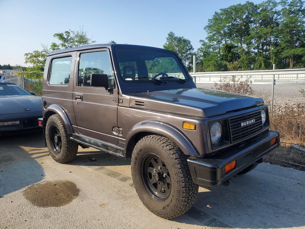 1986 Suzuki Samurai VIN JS3JC51V8G4110639 COPART salvage auction — Water/Flood, FL - CERT OF TITLE-SLVG REBLD FLOOD (P), sold $3,100 on 2026-09-09 (photo 4)