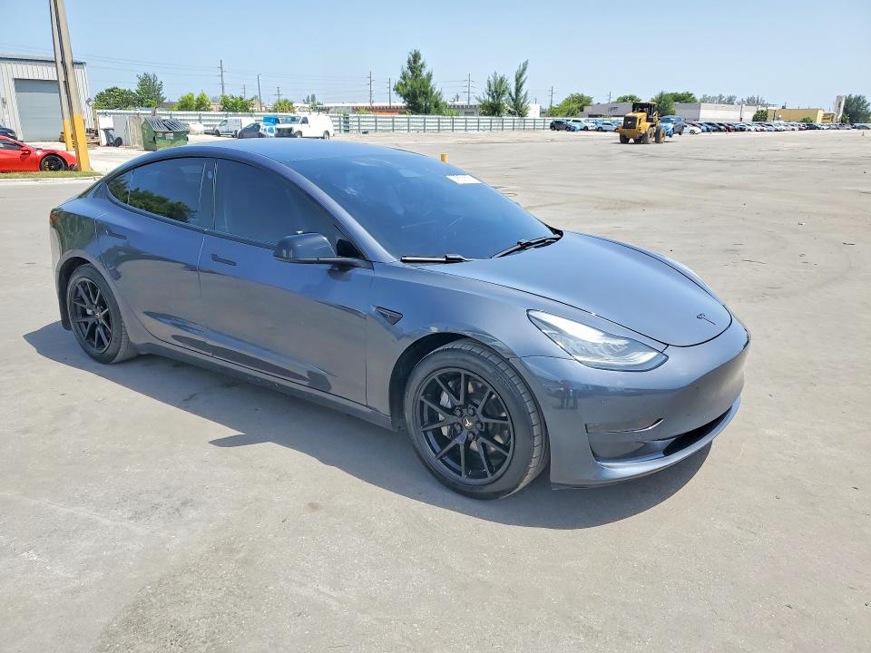 2021 Tesla Model 3 VIN 5YJ3E1EA8MF854022 COPART salvage auction — MINOR DENT/SCRATCHES, Fl - Cert Of Title-Rebuilt, sold $8,600 on 2026-09-09 (photo 4)