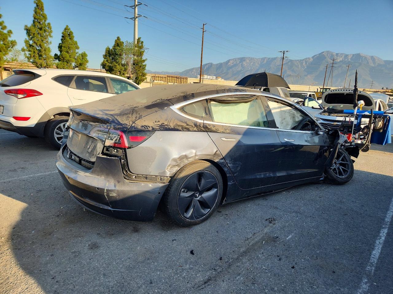 2018 Tesla Model 3 VIN 5YJ3E1EA3JF157661 COPART salvage auction — All Over, CA - DIS/DLR/EXP ONLY CLEAN TITLE (P), sold $1,950 on 2026-10-02 (photo 3)