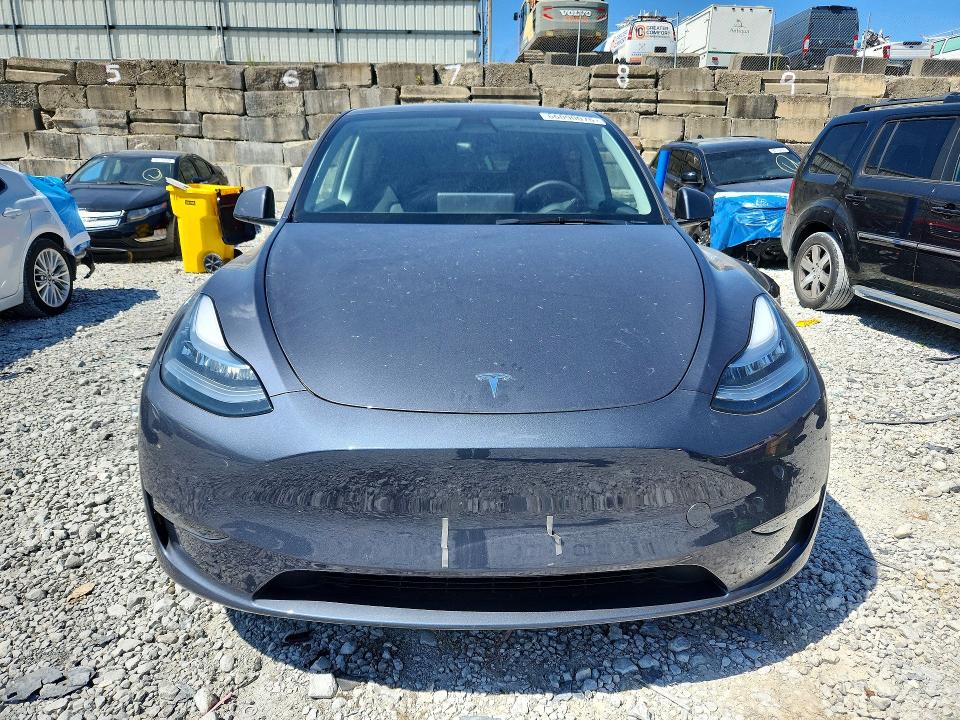 2023 Tesla Model y VIN 7SAYGDEE5PA060216 COPART salvage auction — REAR END, Salvage Title, sold $17,000 on 2026-10-16 (photo 5)