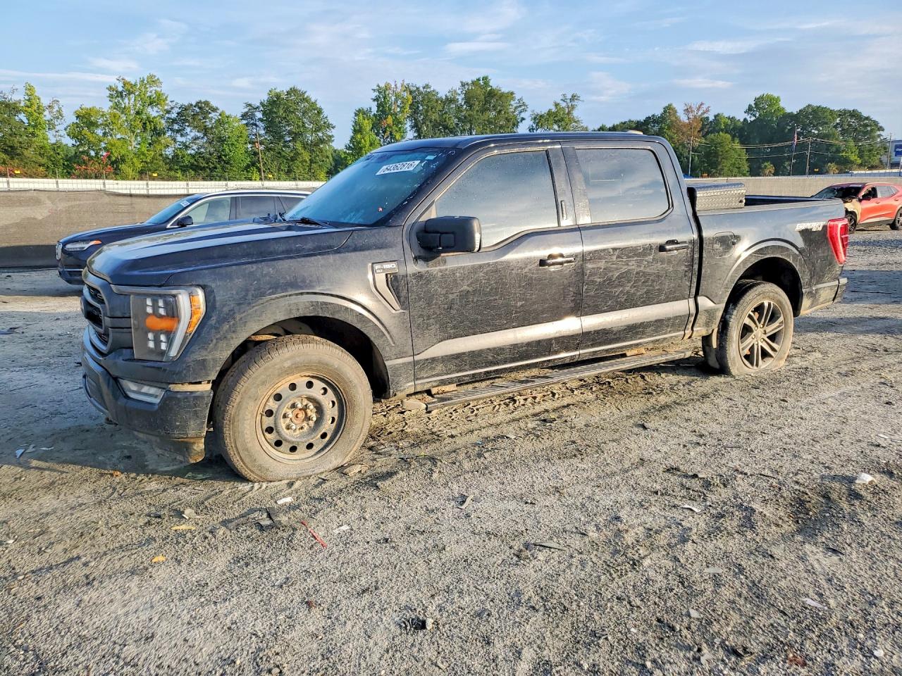 2021 Ford F-150 Lightning VIN 1FTEW1EP3MFC01944 — COPART salvage auction photo