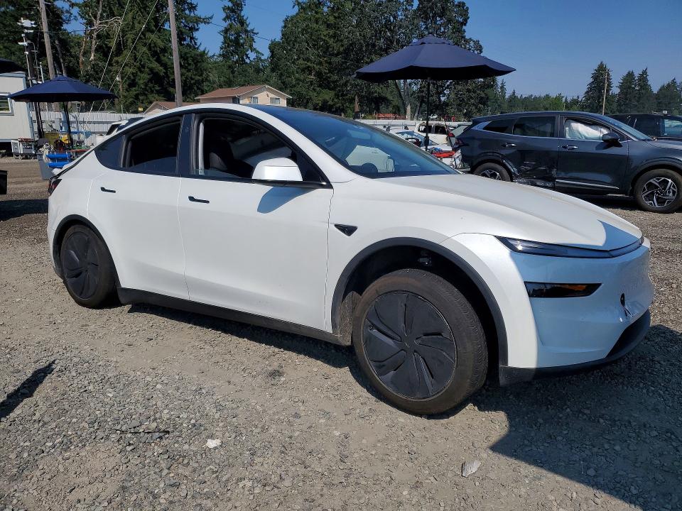 2026 Tesla Model y VIN 7SAYGDEDXTF459577 COPART salvage auction — SIDE, WA, sold $14,600 on 2026-10-16 (photo 4)