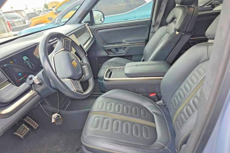 2023 Rivian R1s VIN 7PDSGABA4PN019950 COPART salvage auction — NORMAL WEAR, AZ - CERT OF TITLE-RESTORED SALVAGE (P), sold $39,250 on 2026-09-02 (photo 9)
