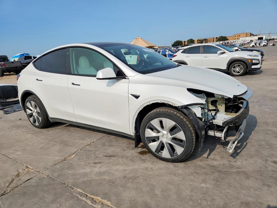 2023 Tesla Model y VIN 7SAYGDEEXPF780999 COPART salvage auction — FRONT END, Tx - Certificate Of Title, sold $5,000 on 2026-09-08 (photo 4)