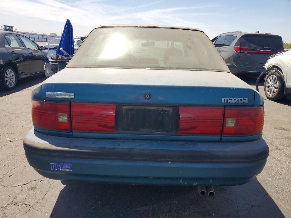 1994 Mazda Protege VIN JM1BG2264R0706581 COPART salvage auction — REAR END, CA - DIS/DLR/EXP APP FOR DUP CLEAN, sold $60 on 2026-09-03 (photo 6)