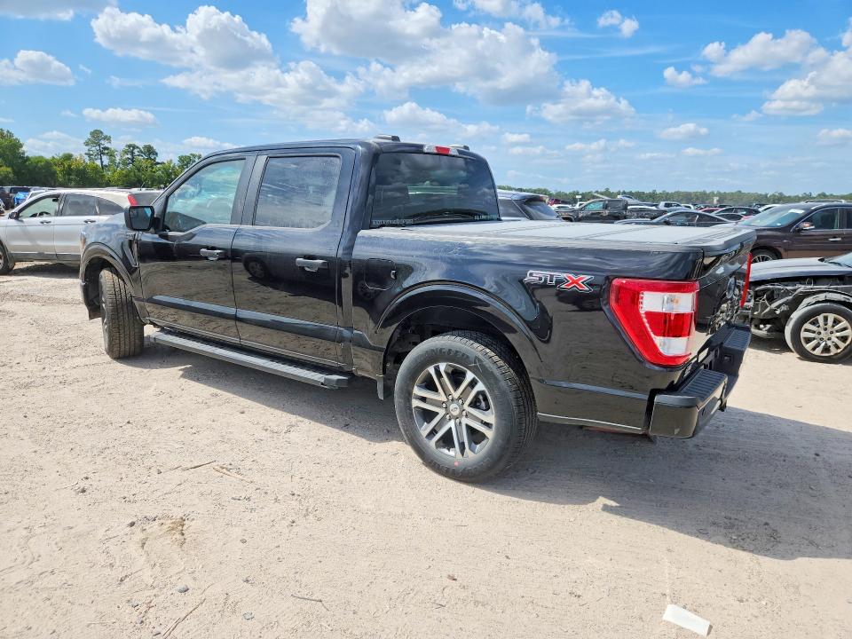 2023 Ford F-150 lightning VIN 1FTEW1C52PKF38909 COPART salvage auction — SIDE, TX - SALVAGE VEHICLE TITLE, sold $13,100 on 2026-08-21 (photo 2)