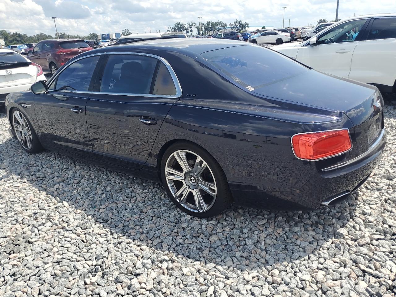 2014 Bentley Flying spur VIN SCBEC9ZA1EC094542 COPART salvage auction — Front End, FL - CERTIFICATE OF TITLE (P), sold $33,000 on 2025-12-08 (photo 2)