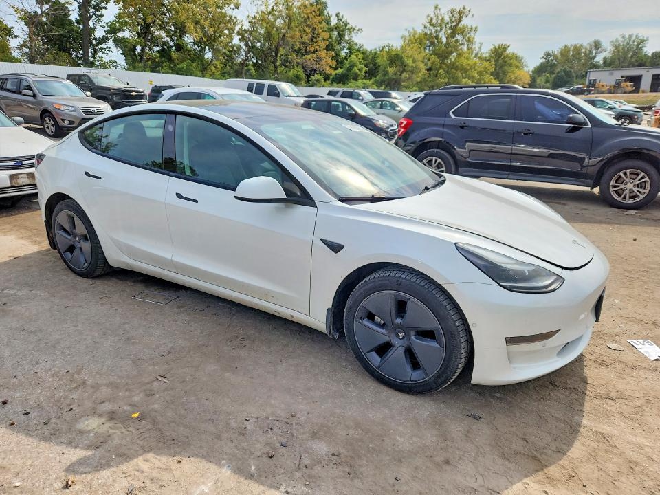 2022 Tesla Model 3 VIN 5YJ3E1EB7NF249466 COPART salvage auction — SIDE, MO - SALVAGE CERTIFICATE OF TITLE, sold $11,200 on 2026-10-23 (photo 4)
