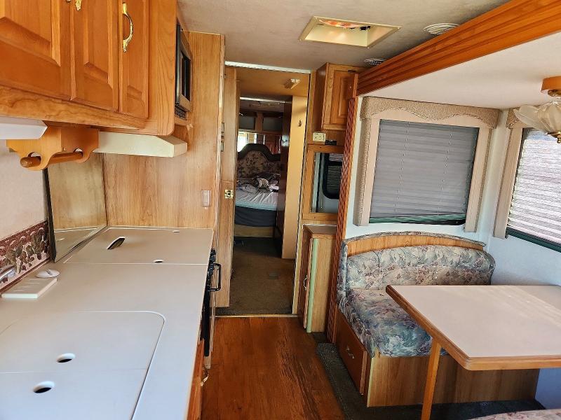 1999 Coachmen Santara VIN 3FCNF53S0XJA06288 COPART salvage auction — REAR END, OH - CERT OF TITLE-SALVAGE, sold $950 on 2026-10-01 (photo 6)