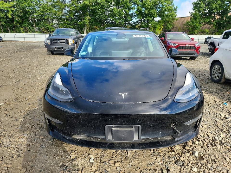 2021 Tesla Model 3 VIN 5YJ3E1EA0MF028426 COPART salvage auction — MINOR DENT/SCRATCHES, Ma - Certificate Of Title (P), sold $10,700 on 2026-10-07 (photo 5)