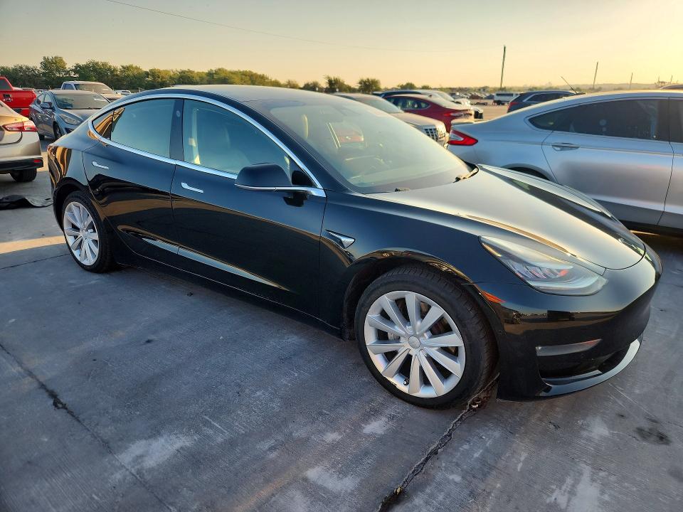 2019 Tesla Model 3 VIN 5YJ3E1EA8KF406375 COPART salvage auction — NORMAL WEAR, TX - CERT OF TITLE-REBUILT SALVAGE (P), sold $6,100 on 2026-09-29 (photo 4)