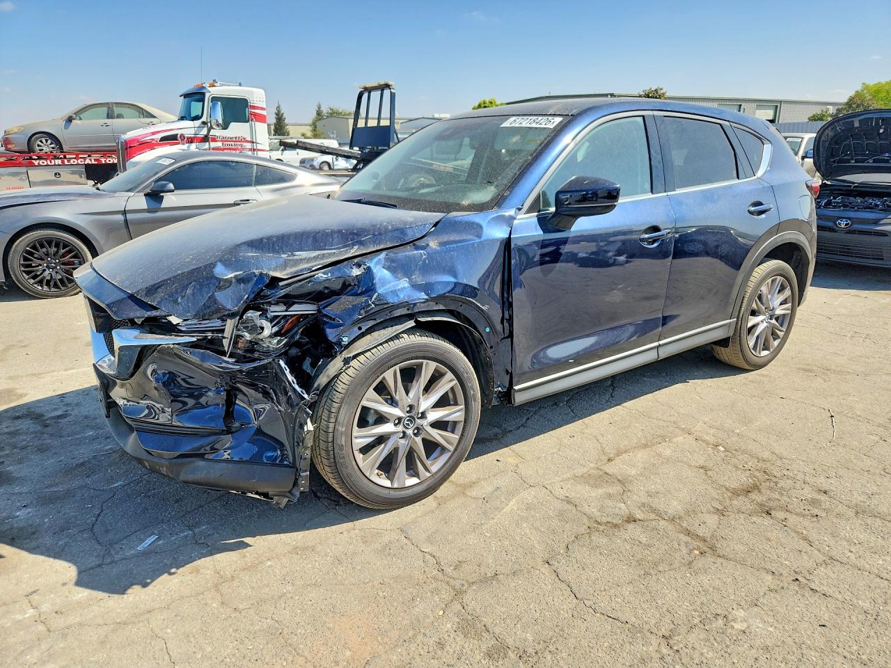 2020 Mazda CX-5 VIN JM3KFBDM5L0797048 — COPART salvage auction photo