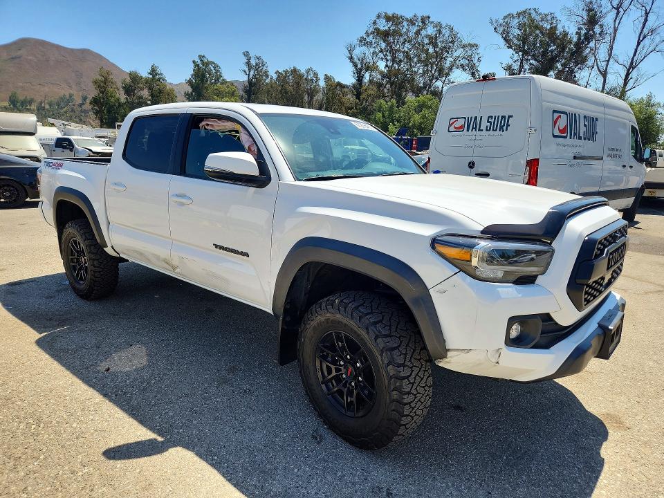 2023 Toyota Tacoma VIN 3TMCZ5AN6PM625469 COPART salvage auction — SIDE, CA - SALVAGE CERTIFICATE, sold $22,100 on 2026-09-15 (photo 4)