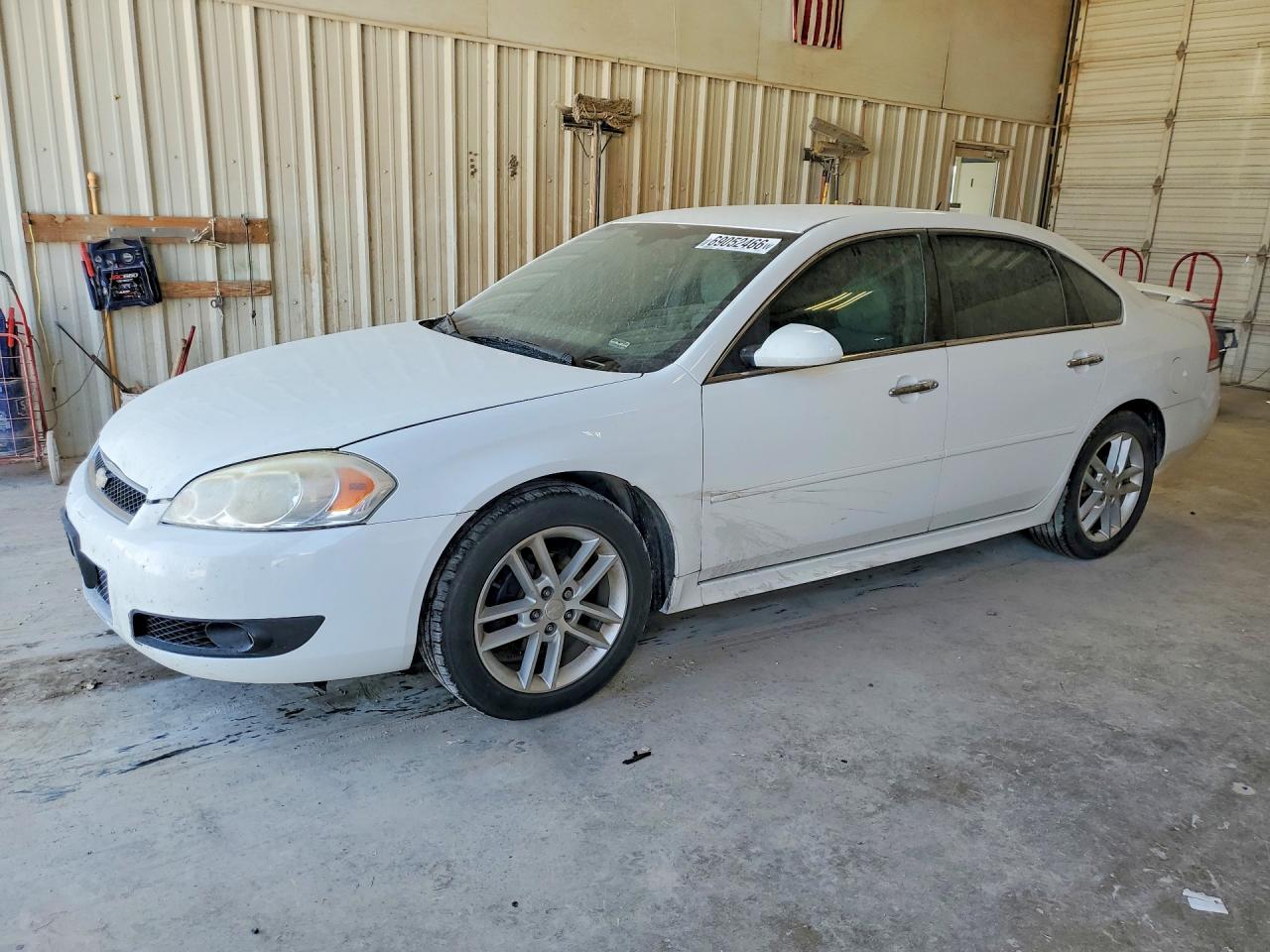 2012 Chevrolet Impala VIN 2G1WC5E34C1305973 COPART salvage auction — Hail, TX - CERTIFICATE OF TITLE, sold $450 on 2026-10-03 (photo 1)