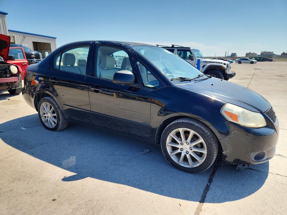 2011 Suzuki Sx4 VIN JS2YC5A21B6303012 COPART salvage auction — MINOR DENT/SCRATCHES, MS - CERTIFICATE OF TITLE, sold $325 on 2026-10-21 (photo 4)
