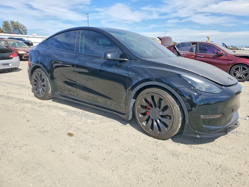 2023 Tesla Model y VIN 7SAYGDEFXPF702988 COPART salvage auction — FRONT END, Salvage Title, sold $15,600 on 2026-10-08 (photo 4)