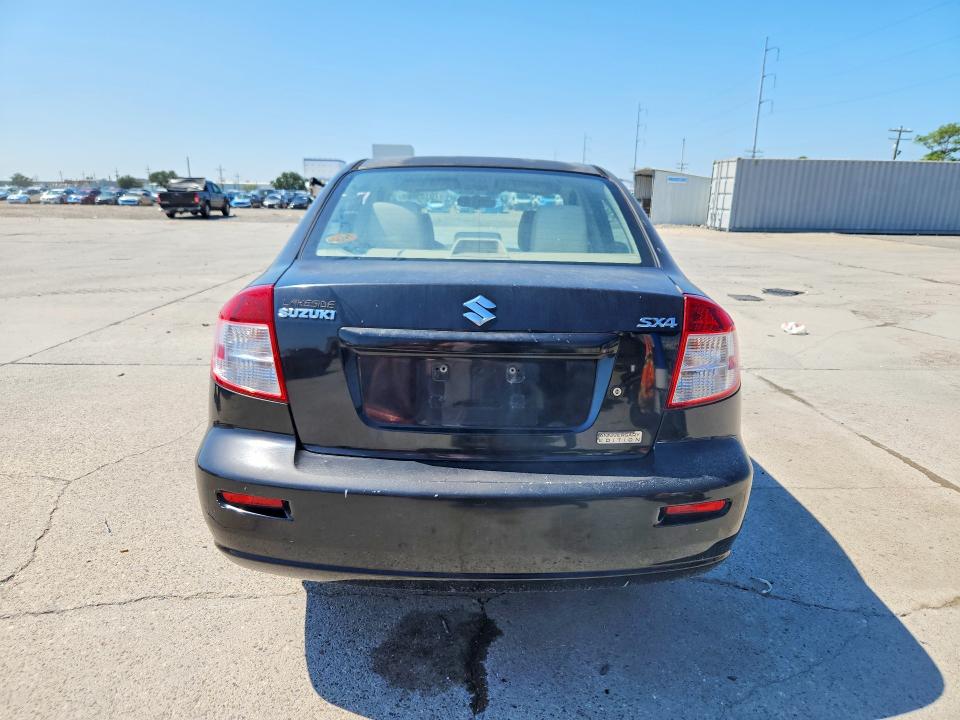 2011 Suzuki Sx4 VIN JS2YC5A21B6303012 COPART salvage auction — MINOR DENT/SCRATCHES, MS - CERTIFICATE OF TITLE, sold $325 on 2026-10-21 (photo 6)