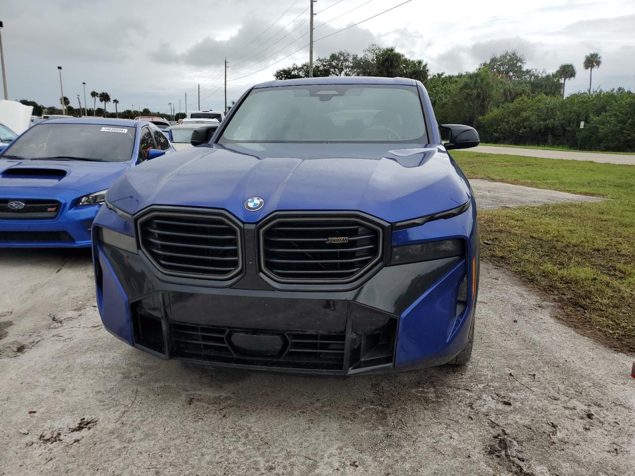 2023 BMW Xm VIN 5YM23CS0XP9S15459 COPART salvage auction — WATER/FLOOD, FL - CERT OF TITLE-SLVG REBLD FLOOD, sold $78,500 on 2024-10-15 (photo 5)