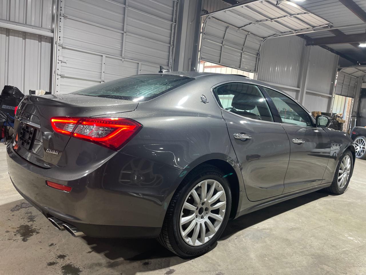 2017 Maserati Ghibli VIN ZAM57XSA9H1206127 COPART salvage auction — NORMAL WEAR, TX - SALVAGE W/LEMON LAW HISTORTY (P), sold $26,750 on 2024-11-08 (photo 4)