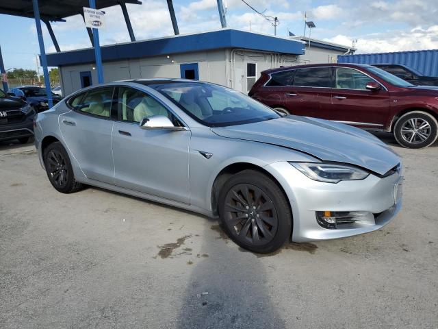 2017 Tesla VIN 5YJSA1E20HF218801 COPART salvage auction — WATER/FLOOD, Fl - Cert Of Title-Slvg Rebld Flood, sold $7,600 on 2026-08-31 (photo 4)