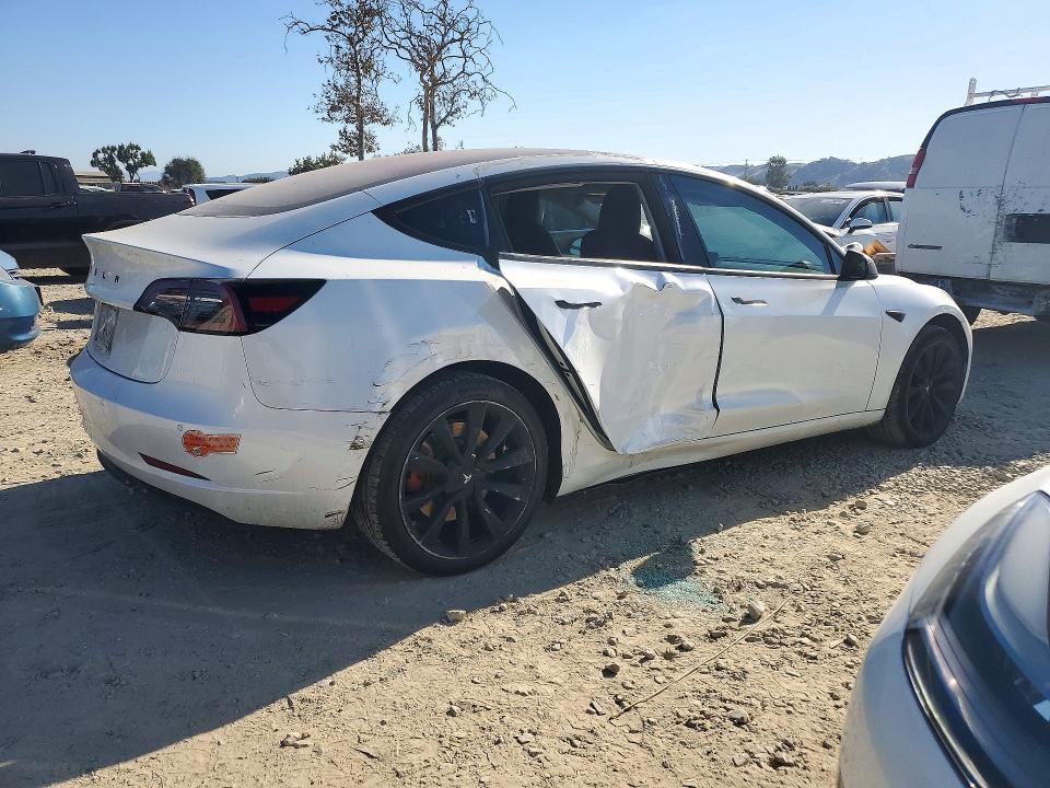 2017 Tesla Model 3 VIN 5YJ3E1EA2HF002612 COPART salvage auction — SIDE, CA - DIS/DLR/EXP ONLY CLEAN TITLE, sold $0 on 2026-10-10 (photo 3)