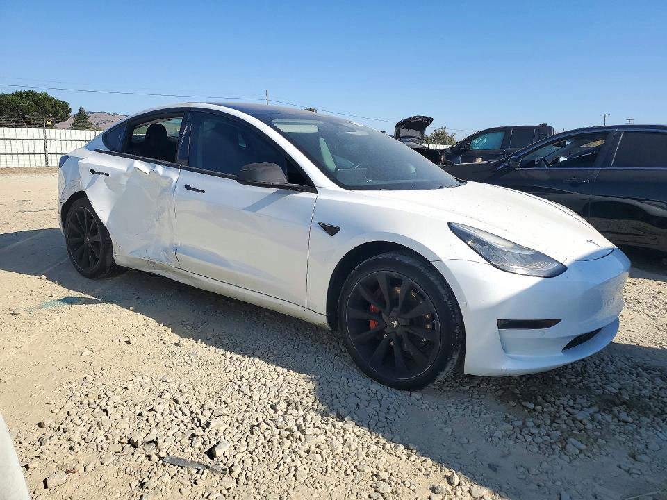 2017 Tesla Model 3 VIN 5YJ3E1EA2HF002612 COPART salvage auction — SIDE, CA - DIS/DLR/EXP ONLY CLEAN TITLE, sold $0 on 2026-10-10 (photo 4)