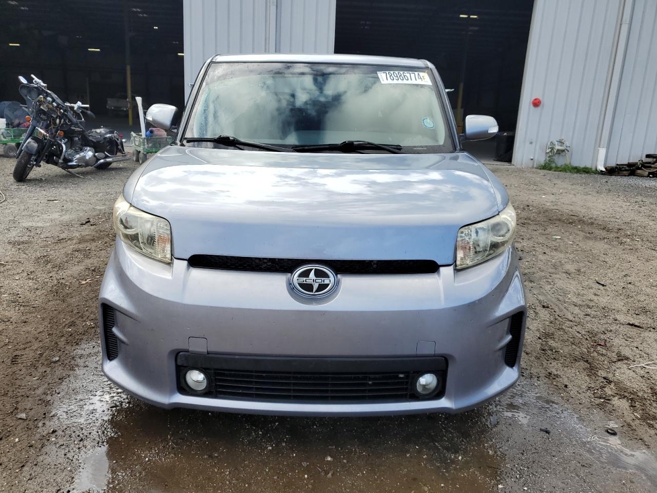 2012 Toyota SCION VIN JTLZE4FE6CJ009498 COPART salvage auction — Side, FL - CERT OF TITLE SLVG REBUILDABLE, sold $1,100 on 2024-12-26 (photo 5)