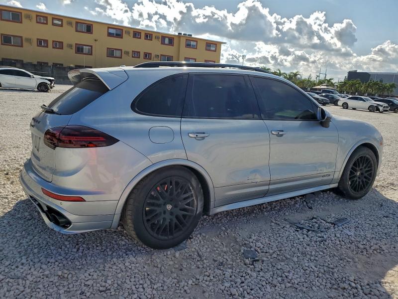2017 Porsche Cayenne VIN WP1AD2A23HLA82321 COPART salvage auction — SIDE, Salvage Title, sold $25 on 2026-08-07 (photo 3)