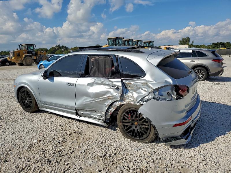 2017 Porsche Cayenne VIN WP1AD2A23HLA82321 COPART salvage auction — SIDE, Salvage Title, sold $25 on 2026-08-07 (photo 2)