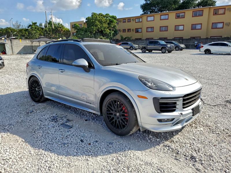 2017 Porsche Cayenne VIN WP1AD2A23HLA82321 COPART salvage auction — SIDE, Salvage Title, sold $25 on 2026-08-07 (photo 4)
