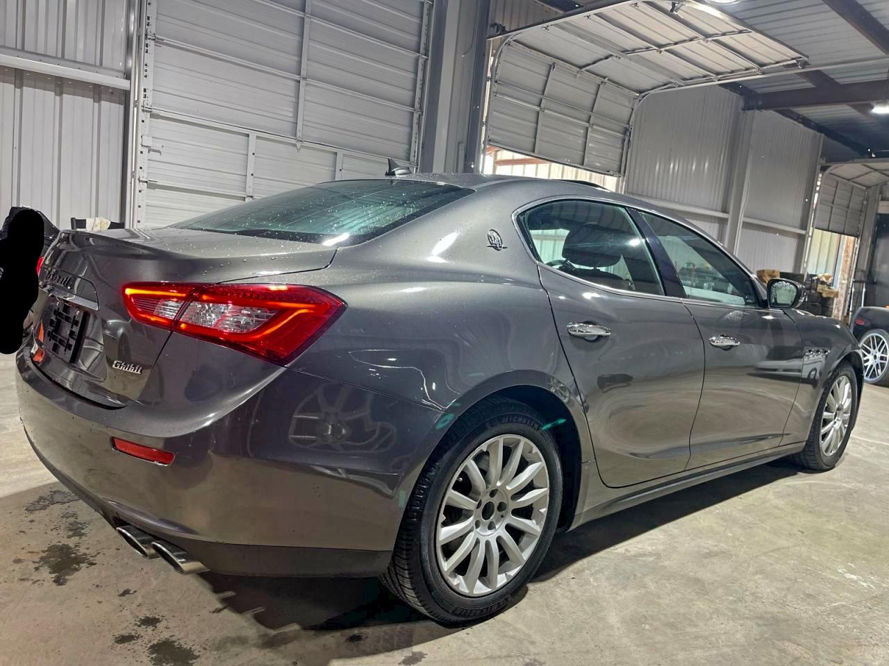 2017 Maserati Ghibli VIN ZAM57XSA9H1206127 COPART salvage auction — Damage History, Tx - Salvage Cert-Manufacturer Buyb (P), sold $33,500 on 2026-01-05 (photo 4)