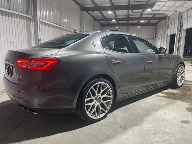 2017 Maserati Ghibli VIN ZAM57XSA9H1206127 COPART salvage auction — NORMAL WEAR, TX - CERT OF TITLE-REBUILT SALVAGE (P), sold $2,100 on 2025-03-11 (photo 4)