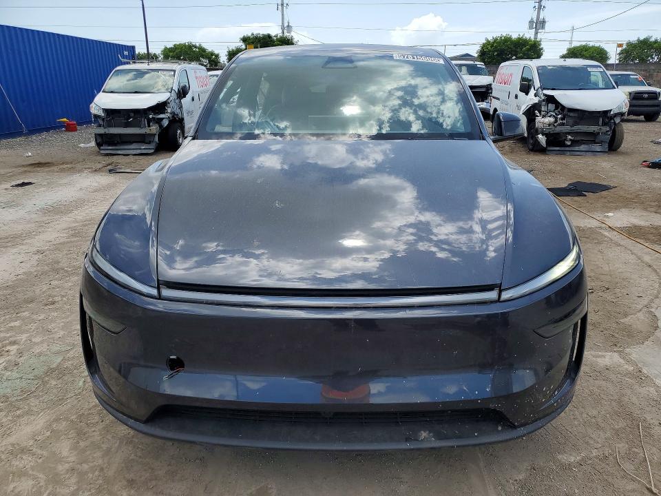 2026 Tesla Model y VIN 7SAYGDEE7TA635782 COPART salvage auction — SIDE, Fl - Cert Of Title Slvg Rebuildable, sold $5,700 on 2026-07-23 (photo 5)