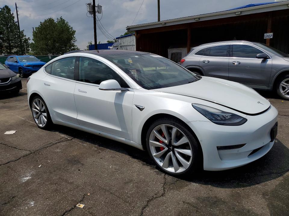 2018 Tesla Model 3 VIN 5YJ3E1EB5JF151501 COPART salvage auction — SIDE, Co - Public - Salvage Title, sold $8,500 on 2026-08-04 (photo 4)