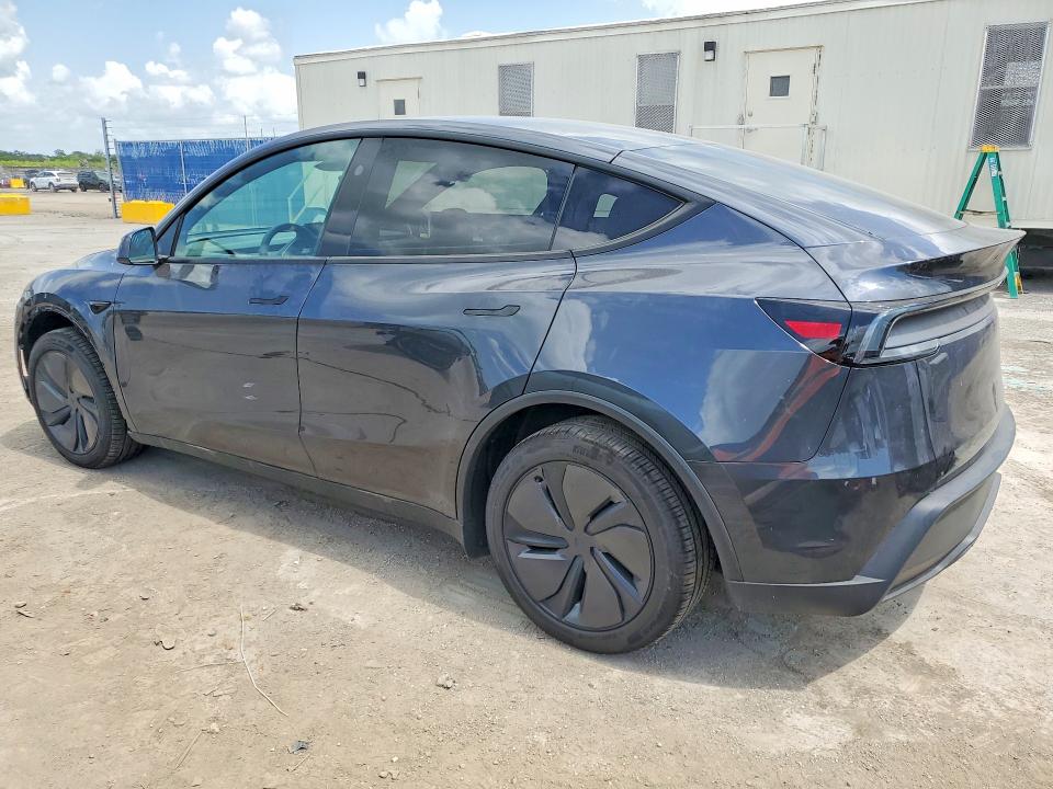 2026 Tesla Model y VIN 7SAYGDEE7TA635782 COPART salvage auction — SIDE, Fl - Cert Of Title Slvg Rebuildable, sold $5,700 on 2026-07-23 (photo 2)