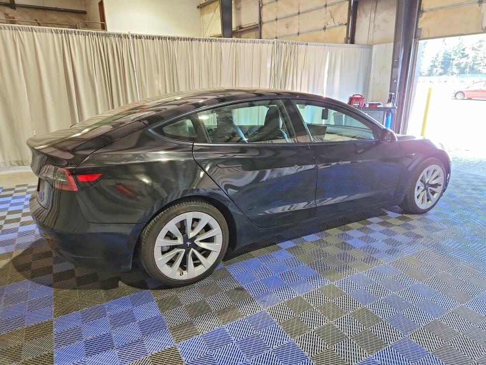 2022 Tesla Model 3 VIN 5YJ3E1EA1NF304663 COPART salvage auction — SIDE, Wa - Vehicle Cert Of Ownership-Titl, sold $6,100 on 2026-08-03 (photo 3)