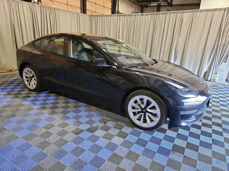 2022 Tesla Model 3 VIN 5YJ3E1EA1NF304663 COPART salvage auction — SIDE, Wa - Vehicle Cert Of Ownership-Titl, sold $6,100 on 2026-08-03 (photo 4)