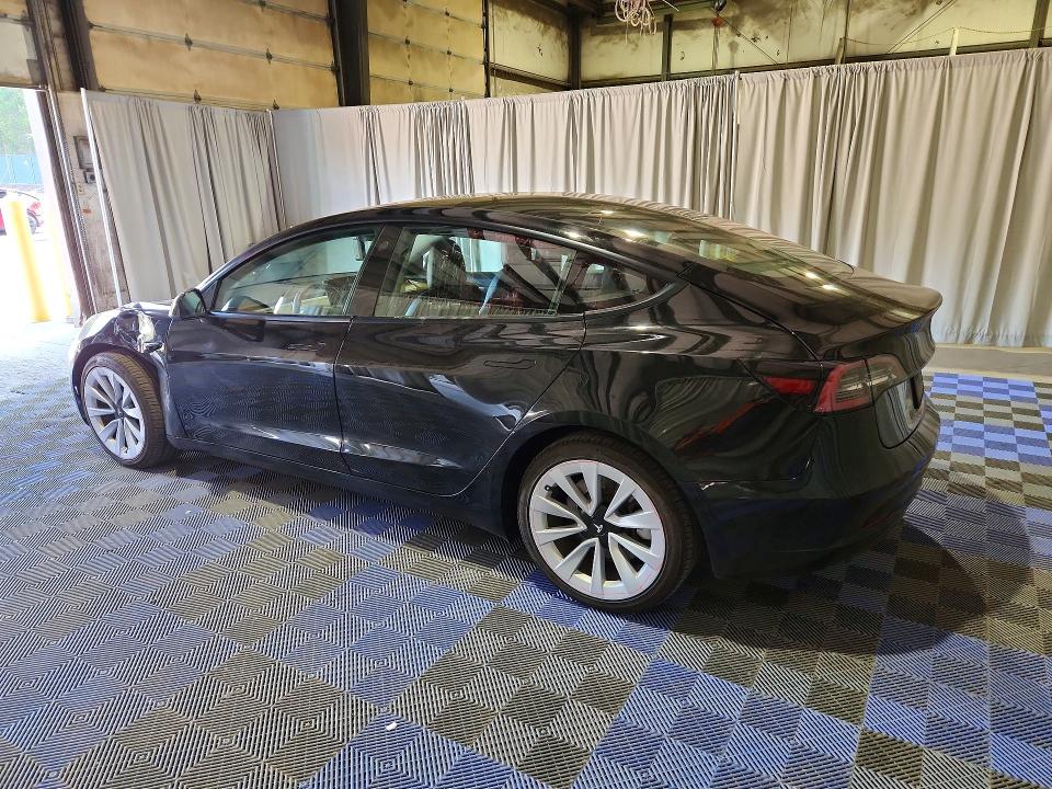 2022 Tesla Model 3 VIN 5YJ3E1EA1NF304663 COPART salvage auction — SIDE, Wa - Vehicle Cert Of Ownership-Titl, sold $6,100 on 2026-08-03 (photo 2)