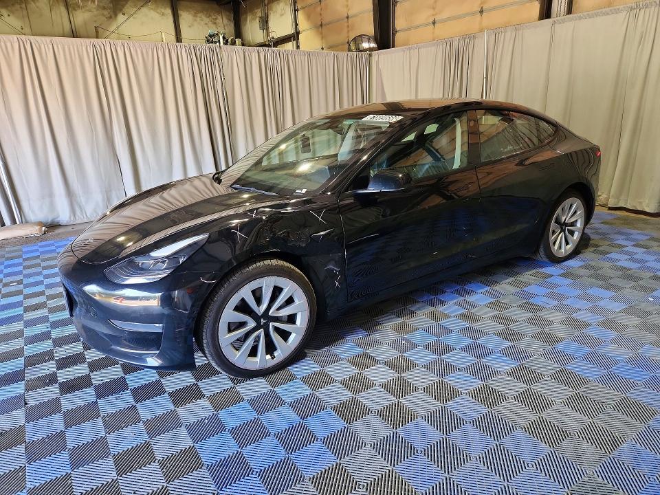 2022 Tesla Model 3 VIN 5YJ3E1EA1NF304663 COPART salvage auction — SIDE, Wa - Vehicle Cert Of Ownership-Titl, sold $6,100 on 2026-08-03 (photo 1)