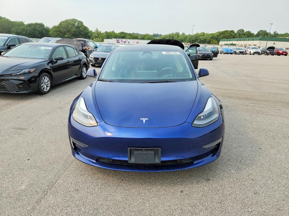 2022 Tesla Model 3 VIN 5YJ3E1EA0NF290318 COPART salvage auction — UNDERCARRIAGE, Fl - Certificate Of Title, sold $4,400 on 2026-07-22 (photo 5)