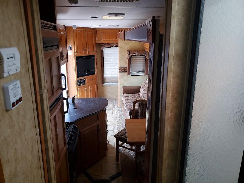2009 Keystone Laredo VIN 4YDF265279L601027 COPART salvage auction — HAIL, SD - CERTIFICATE OF TITLE, sold $0 on 2026-10-03 (photo 6)