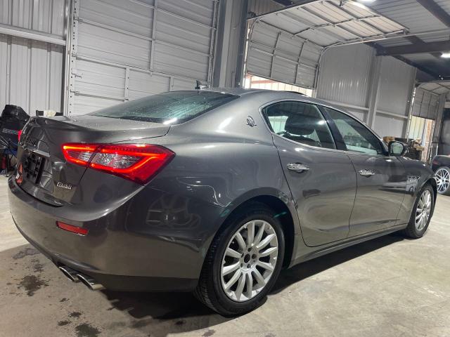 2017 Maserati Ghibli VIN ZAM57XSA9H1206127 COPART salvage auction — NORMAL WEAR, TX - CERT OF TITLE-REBUILT SALVAGE (P), sold $23,900 on 2025-01-03 (photo 4)
